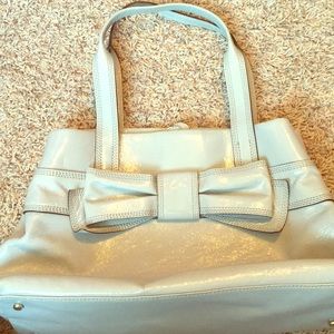 Glossy Kate Spade purse with bow